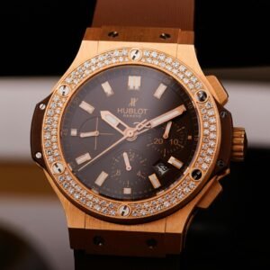 Close-up view of a luxurious gold watch adorned with diamonds, symbolizing elegance.