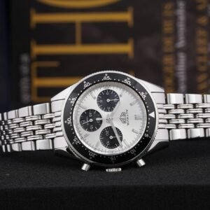 Elegant silver chronograph wristwatch with a detailed clock face and luxury design, perfect for a product showcase.